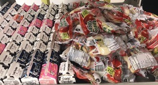 Packaged apples and milk 